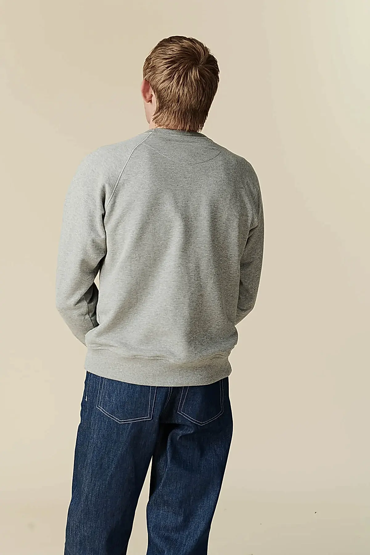 Back of male in raglan sweatshirt grey 
