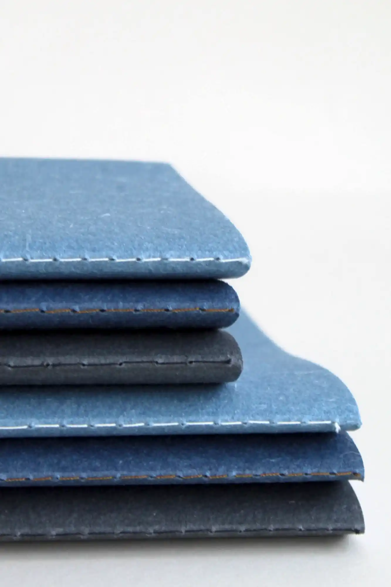 Close up of the notebook set showing 3 colours, blue, indigo and black in both A6 and A5 size